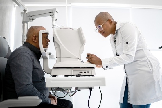 A man gets his eyes examined at the optometrist's office.