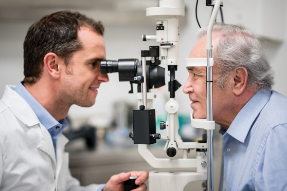 Senior man getting eye exam